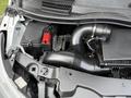A 2020 Mercedes-Benz Metris engine compartment showing the air intake system and battery with clear components and tubes