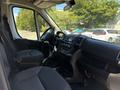 Interior of a 2016 RAM Promaster showing driver and passenger seats with dashboard and steering wheel visible