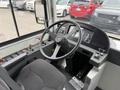 Interior view of a 2018 Grande West Vicinity bus showing the driver's seat steering wheel and control panel