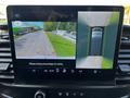 A dashboard display of a 2022 Ford Transit shows a rear camera view with parking guidelines and a bird's-eye view of the vehicle's surroundings