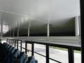 Interior view of a 2022 Blue Bird BB Conventional school bus showing overhead storage and seating arrangement