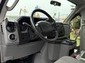 The interior of a 2017 Ford E450 showing the steering wheel dashboard and control panel with various knobs and buttons
