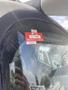 A close-up of a 2003 International 5600i truck's windshield showing a certificate of approval sticker with a registration number and the year 2026