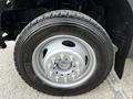 A close-up of a gray truck wheel featuring a shiny steel rim with multiple lug nuts and a Michelin tire labeled XDS 2O