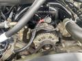 Close-up view of the engine components of a 2017 Ford F-550 featuring the alternator belts and various hoses