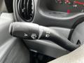 A close-up of the turn signal and light control stalk from a 2004 Ford Econoline with various symbols indicating functions
