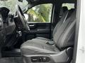 Interior view of the front seats of a 2021 Chevrolet Silverado 3500HD featuring cloth upholstery and a modern dashboard design