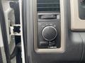 Close-up of the interior control panel of a 2011 Dodge Ram 5500 featuring knobs for lights and various settings