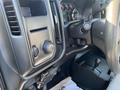 Interior view of a 2018 GMC Sierra 1500 showing the dashboard controls steering wheel and gear shift