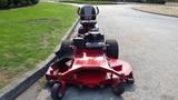 A red 2014 Ferris Mower ISX 800 with a large mower deck and a high-back seat positioned at the front with a powerful engine visible on the chassis