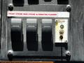 Control panel with three toggle switches labeled for front strobe rear strobe and alternating flashers with an additional alert indicator light and reset button