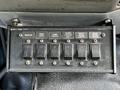 Control panel with six toggle switches labeled for various lights including beacon whip light comp lights and work lights