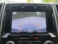 Rearview camera display of a 2020 Ford F-350 Super Duty showing guidelines for parking and safety warnings