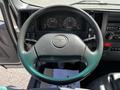 Steering wheel of a 2007 GMC W3500 with instrument cluster and control buttons visible
