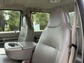 2008 Ford F-550 with two front seats in light gray upholstery featuring a center console between them