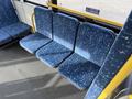 Interior seating of a 2016 Grande West Vicinity bus featuring four blue upholstered seats with a geometric pattern