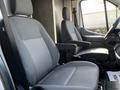 Two front seats of a 2022 Ford Transit in grey upholstery with armrests and a minimalist design