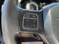 Close-up of the steering wheel of a 2015 RAM 5500 featuring control buttons including voice recognition and phone functions