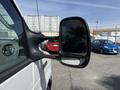 A 2023 Ford E-450 with a side mirror prominently displayed showing a reflective surface and a sturdy black frame