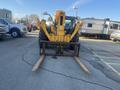 A 2013 JCB 510-56 Loadall with large yellow lifting arms and forks positioned in front ready for heavy lifting