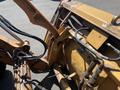 2011 Case 570 MXT backhoe loader showing hydraulic lines and connector joints