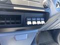 A control panel featuring four auxiliary buttons labeled AUX 1 to AUX 4 in a 2015 Ford F-450 SD