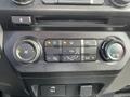 Dashboard controls of a 2017 Ford F-250 SD featuring climate control buttons and knobs