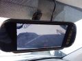 A rearview mirror display showing a backup camera view for a 2016 Mercedes-Benz Sprinter