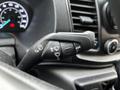 Close-up of the control stalk in a 2020 Ford Transit featuring buttons for windshield wipers turn signals and headlights