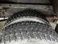 Close-up of the tread on a tire from a 2012 Ford Econoline showing detailed patterns and texture designed for traction