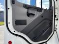 A 2016 Freightliner M2 106 truck door interior featuring a gray panel with a handle and a blank nameplate area