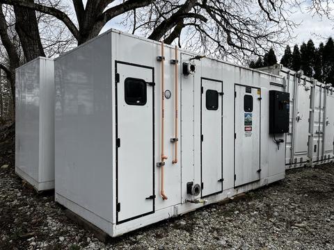 Huntair Custom Air Handler Unit with white exterior multiple access doors and copper piping connected to the side