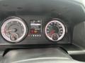 A dashboard display of a 2019 RAM 1500 Classic showing gauges for speed and fuel along with a digital screen displaying trip information and vehicle settings