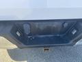 Close-up of the rear bumper area of a 2017 Ford F-150 featuring a receiver hitch and lighting connections