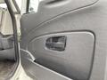 Interior door panel of a 2014 International Durastar featuring a handle and textured black material
