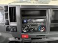 Interior dashboard of a 2017 Isuzu NPR HD featuring a radio unit climate control knobs and various buttons for vehicle functions