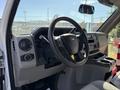 Interior view of a 2021 Ford Econoline showing the steering wheel dashboard and control panel