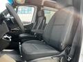 Interior view of a 2019 Mercedes-Benz Sprinter showing two front seats and dashboard with steering wheel and console