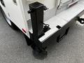A 2016 Ford F-550 with a heavy-duty black hitch mounted on the rear featuring a coordinating platform and connectors for towing or equipment attachment