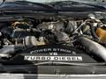 A 2008 Ford F-550 engine featuring a Power Stroke V8 turbo diesel with various components including hoses and pipes connected around the engine block