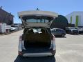 A 2014 Ford Escape with the rear hatch open displaying a spacious cargo area
