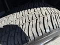 Close-up of a tire tread on a 2017 Ford F-350 SD showing visible wear patterns and grooves designed for traction