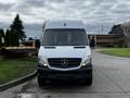 A 2016 Mercedes-Benz Sprinter van facing forward with a white exterior and the iconic Mercedes-Benz logo on the front grille