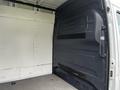 Interior of a 2021 Mercedes-Benz Sprinter van showing a spacious cargo area with a plain wall and a black partition panel