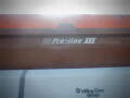A close-up of a Pro-line III logo on a snow plow blade attached to a 2016 International WorkStar 7500 vehicle