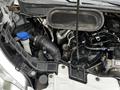 The image shows the engine compartment of a 2021 Ford Transit with visible components such as the air intake and various hoses and connectors
