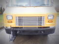 2008 Freightliner MT45 Chassis with a prominent yellow front, featuring a metal grille and headlights on either side