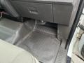 Interior floor of a 2010 Ford F-150 showing textured rubber mat and footwell area