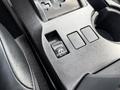 The center console of a 2021 Toyota 4Runner featuring a gear shifter and control buttons including an auto button