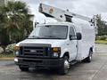 A 2017 Ford Econoline van with a mounted cherry picker and a service body in white paint